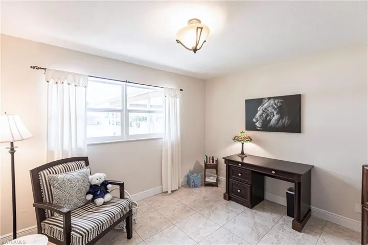 Sitting room featuring baseboards