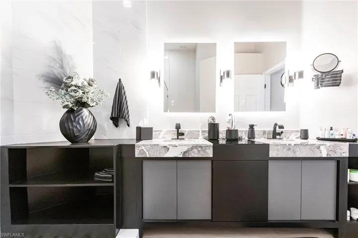 Full bath featuring double vanity