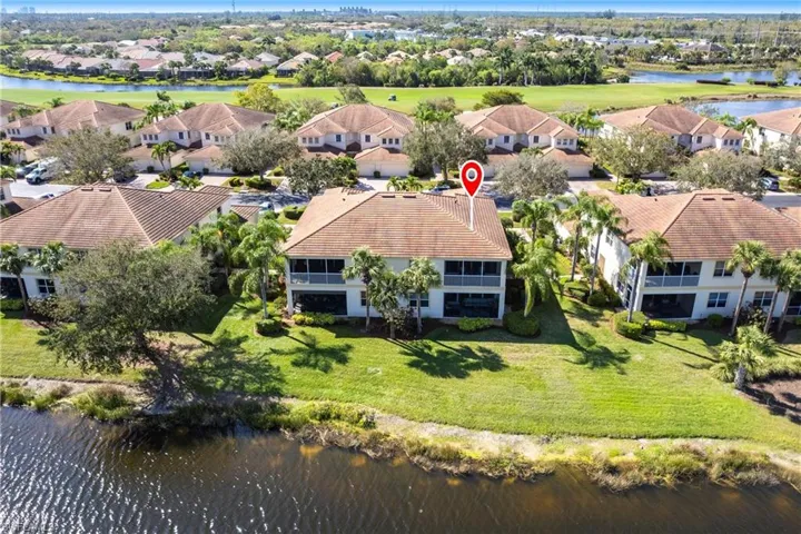 Aerial perspective of suburban area with a large body of water
