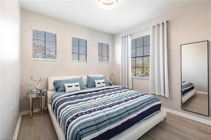 Bedroom featuring baseboards and light wood finished floors