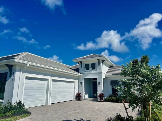 View of front of home featuring a garage