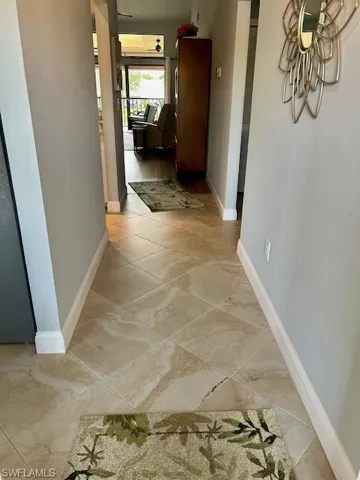 Hall featuring baseboards