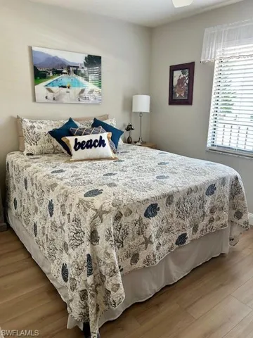 Bedroom with light wood-type flooring and baseboards