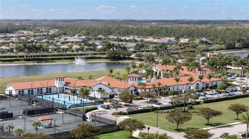 Aerial view of residential area featuring a large body of water