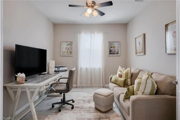 Home office with ceiling fan and wood finished floors