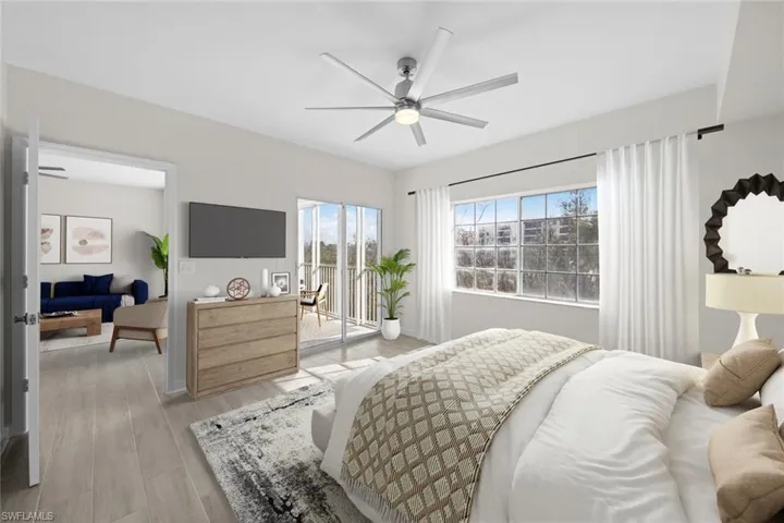 Bedroom with access to outside, wood finished floors, and ceiling fan