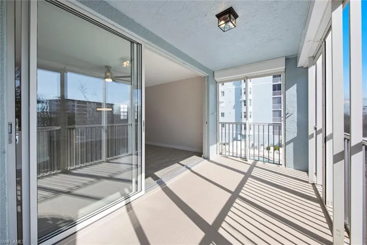 Balcony featuring a sunroom