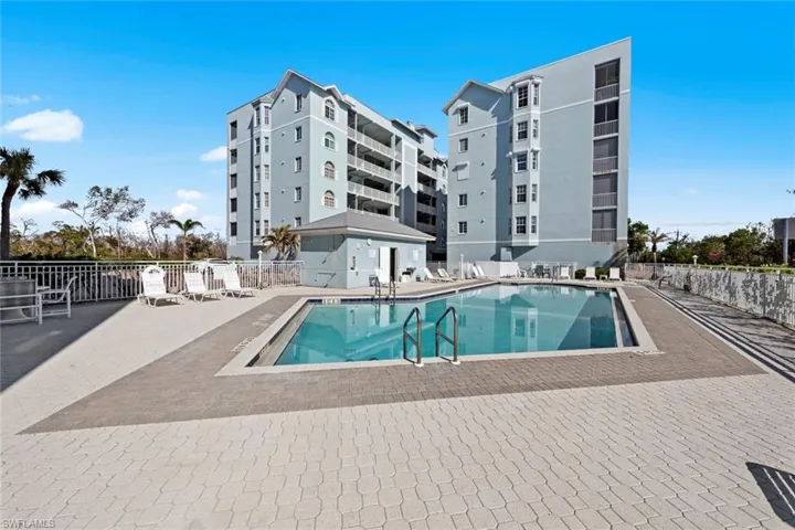 Community pool featuring a patio area
