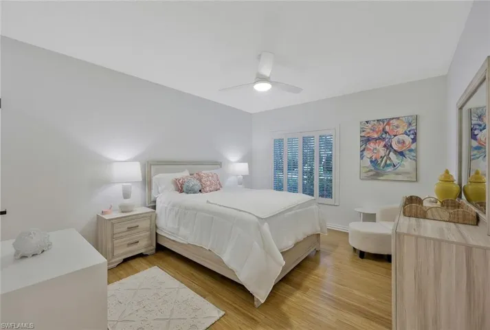 Bedroom featuring light wood finished floors and a ceiling fan