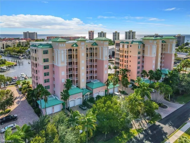 View of property with a water view