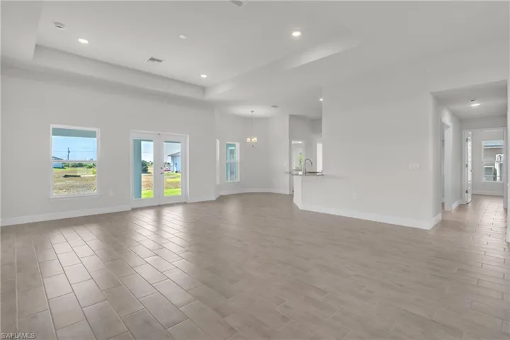 Unfurnished dining area featuring a chandelier and wood finish floors