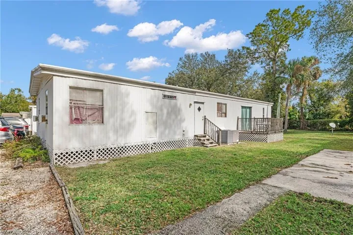 View of front of property with a front yard