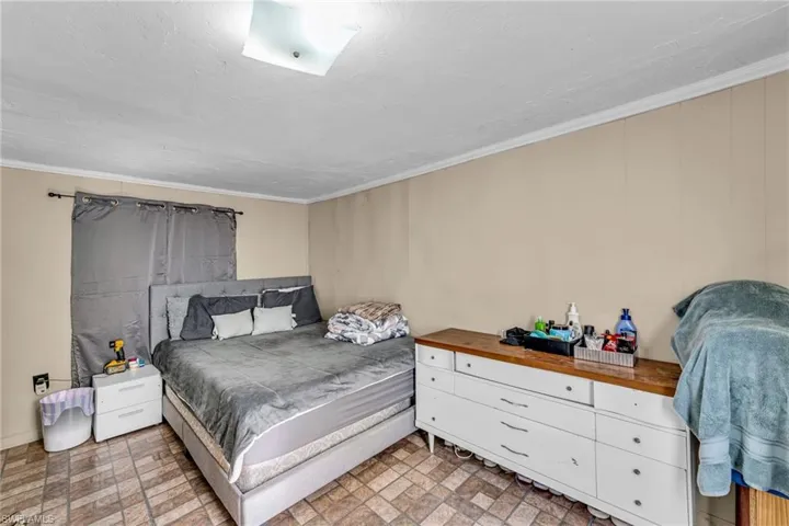 Bedroom featuring ornamental molding