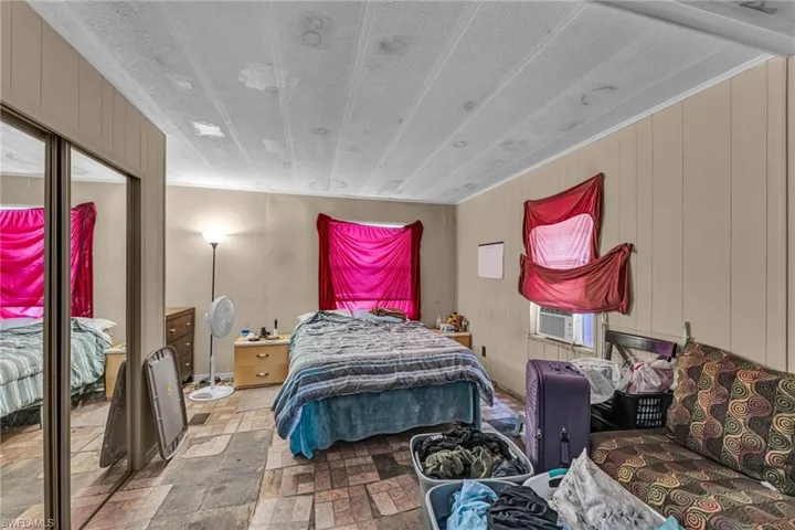 Bedroom featuring cooling unit
