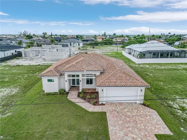 View of front of house with a gazebo and a front yard