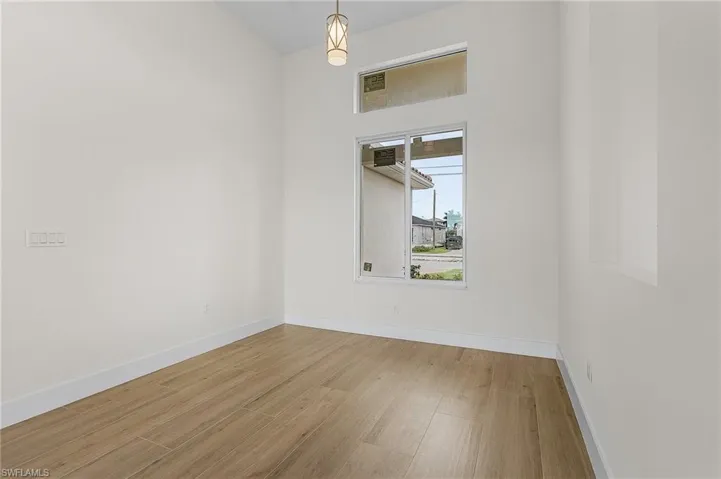 Spare room with light wood-type flooring