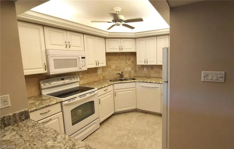 White bright kitchen with plenty of storage