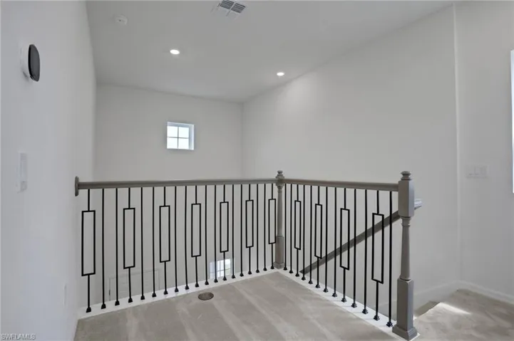 Staircase featuring carpet and recessed lighting