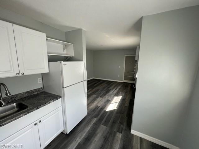 Kitchen looking to living area