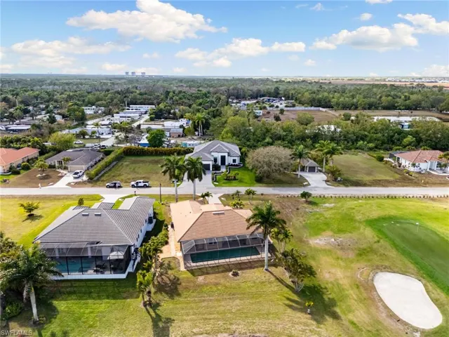 Aerial view of residential area with a golf club