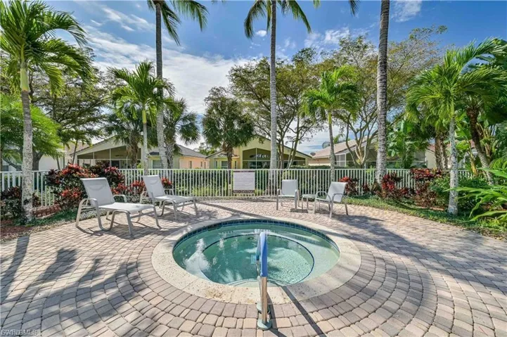 “Relaxing community spa set among lush tropical landscaping.”