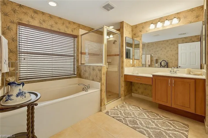 “Primary bath features a soaking tub, separate shower, dual sinks, and plenty of storage.”