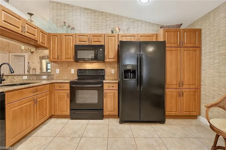 “Light and airy kitchen with breakfast nook, ample cabinetry, and easy flow to the main living spaces.”