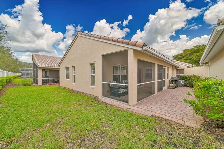 “Peaceful screened lanai overlooking a private, landscaped backyard — perfect for morning coffee or evening relaxation.”