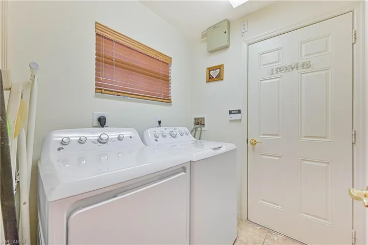 “Convenient in-residence laundry with storage and natural light.”