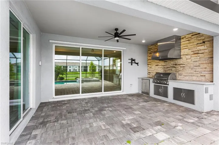 View of patio / terrace featuring an outdoor kitchen and ceiling fan