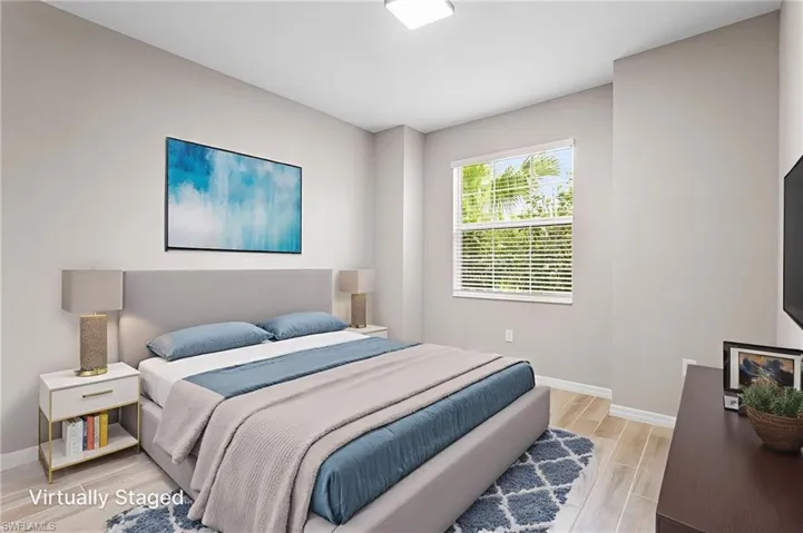 Bedroom with baseboards and light wood finished floors