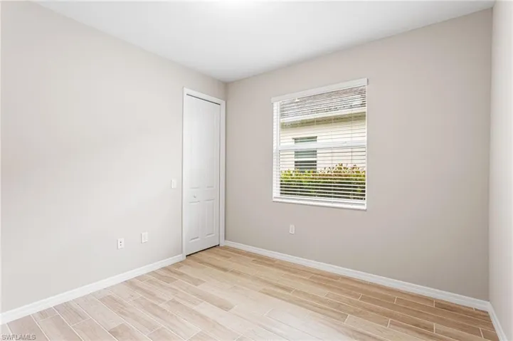 Empty room featuring light wood finished floors