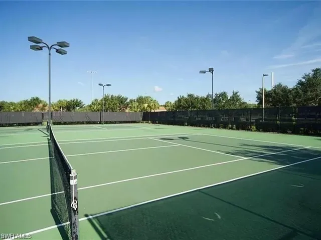 View of tennis court featuring community basketball court