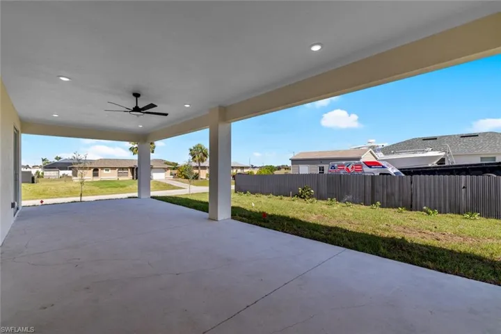 View of patio / terrace featuring ceiling fan and fence
