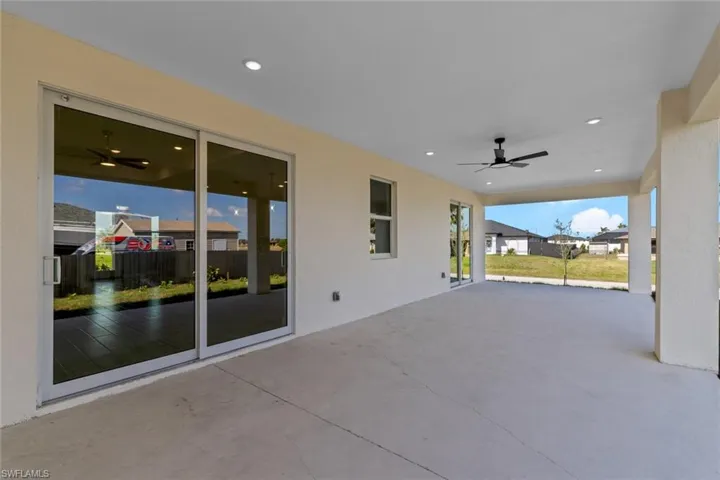 View of patio featuring ceiling fan