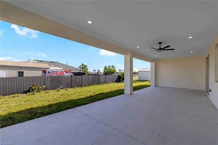 View of patio / terrace with ceiling fan and a fenced backyard