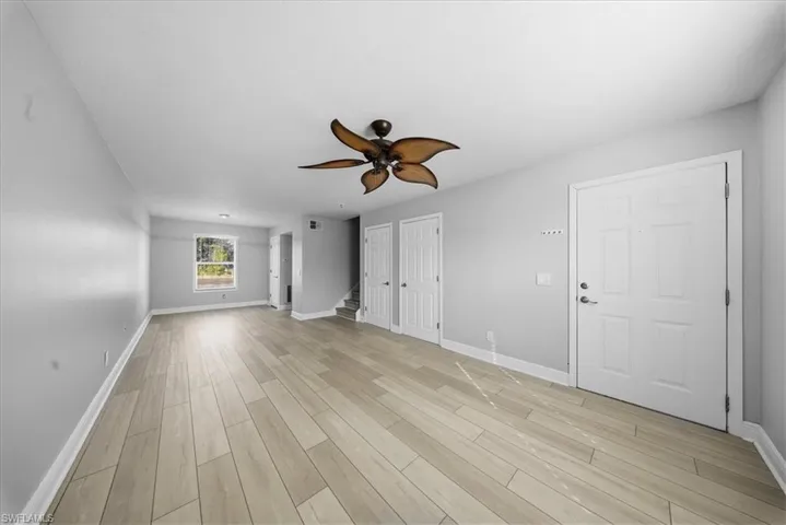 Unfurnished bedroom featuring ceiling fan and light wood-style floors