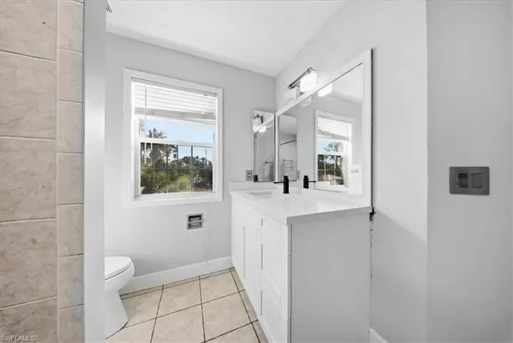 Bathroom featuring vanity and light tile patterned flooring