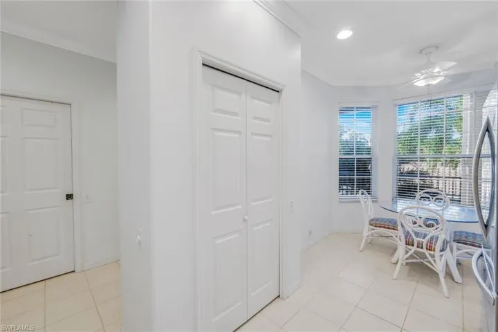 Dining space with crown molding, light tile patterned floors, a ceiling fan, and recessed lighting
