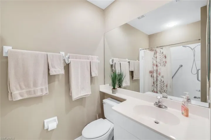 Bathroom with vanity and a shower with shower curtain