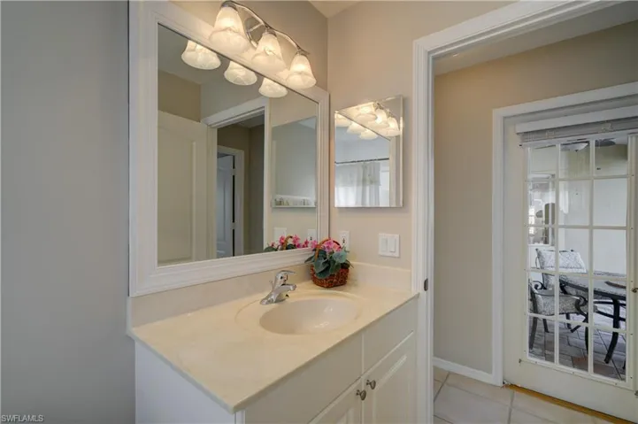 Guest bathroom view showing side door to lanai
