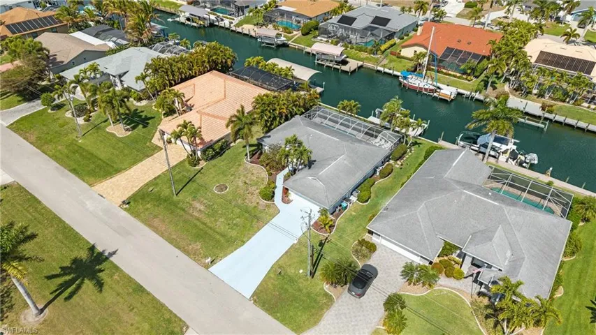 Aerial view of residential area featuring a large body of water