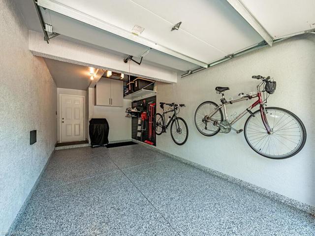 Rarely do you EVER find a coach home garage this nice!  Epoxy floors, garage tech wall, cabinets... its just waiting for your vehicle!