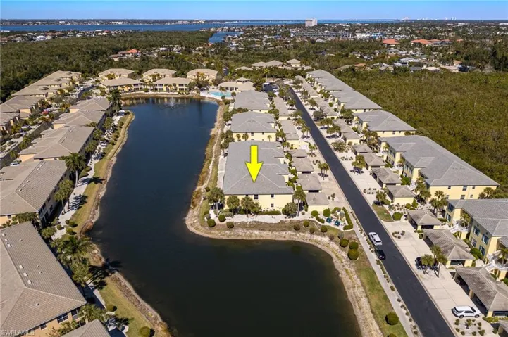View of property location with nearby suburban area and a nearby body of water