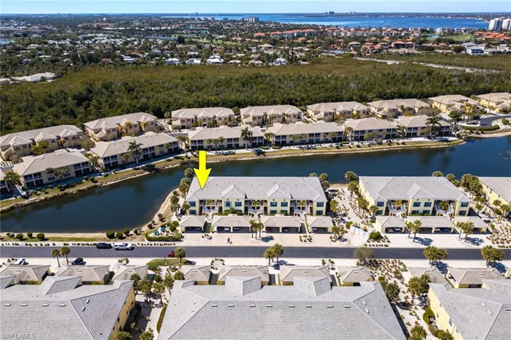 Aerial view of property and surrounding area with nearby suburban area