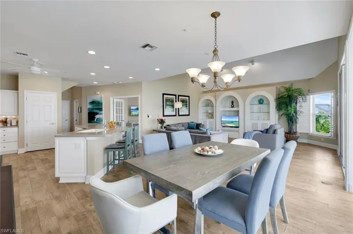 Open-concept living area with wood-finish flooring