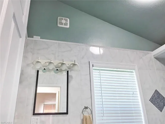 5460- Master Bathroom Upstairs with tile walls and vanity.