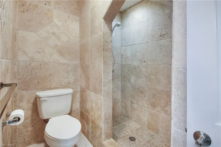 5460-Guest Bathroom-First Floor with tile walls and vanity