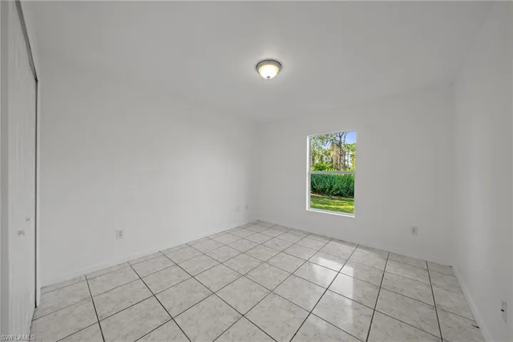 Spare room with light tile patterned floors