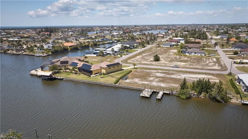 Drone / aerial view featuring a residential view and a water view